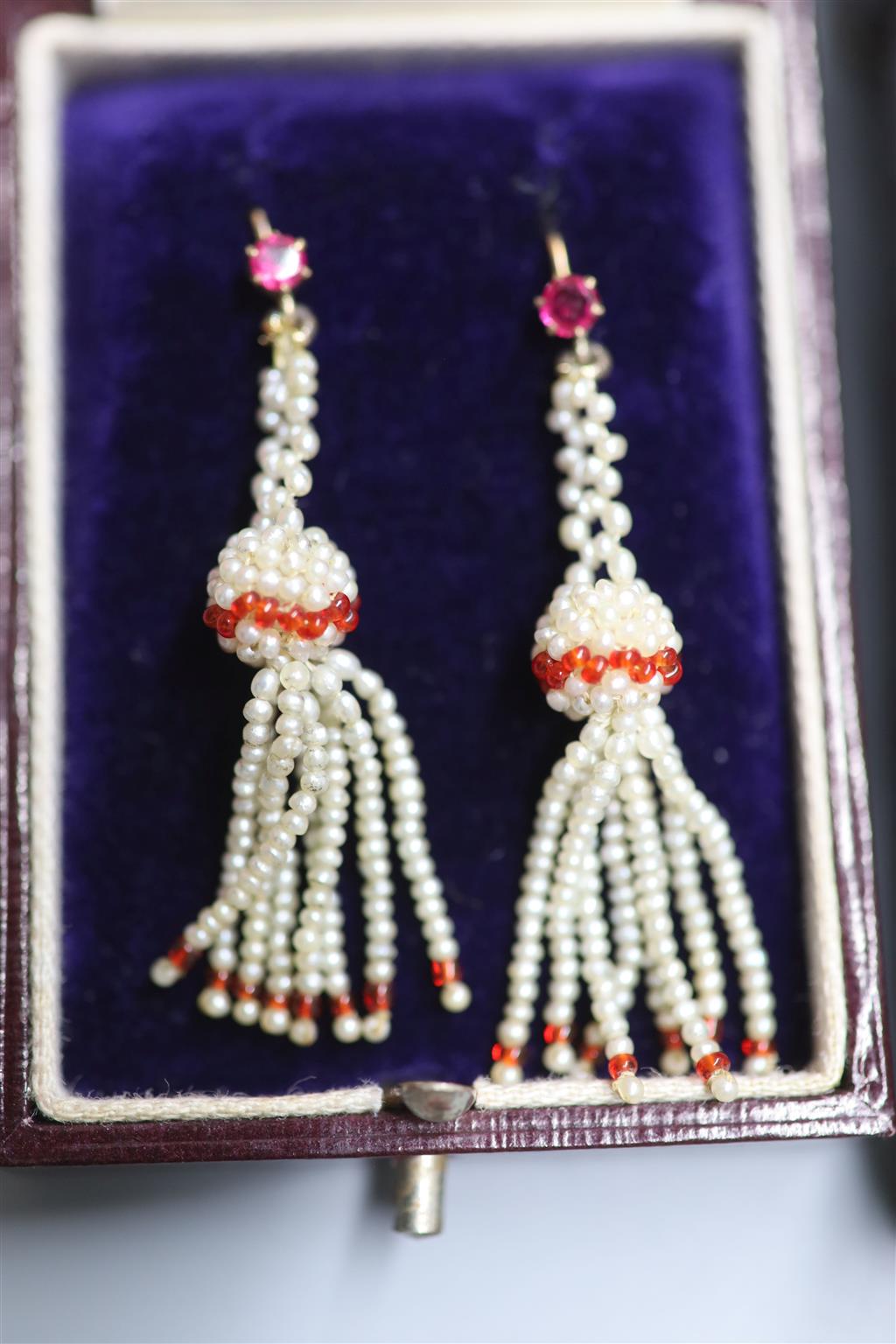 Two pairs of Indian yellow metal, seed pearl cluster and gem set drop earrings, largest 45mm, gross 5.5 grams.